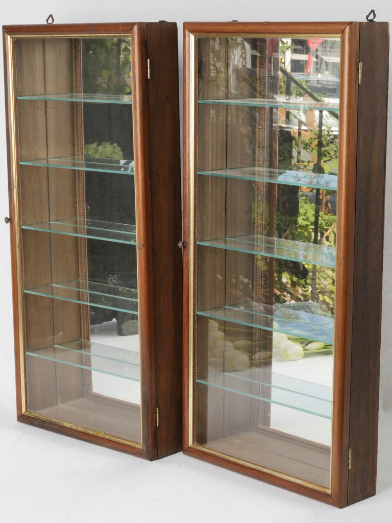 Ornate vintage mirror-back wall showcases