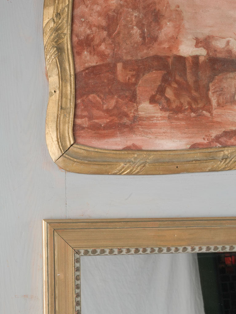 Vintage ornate mirror with aged glass