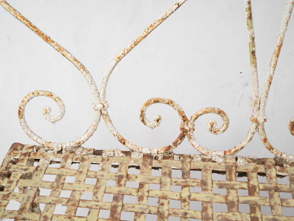 Timeworn elegant wrought iron seat