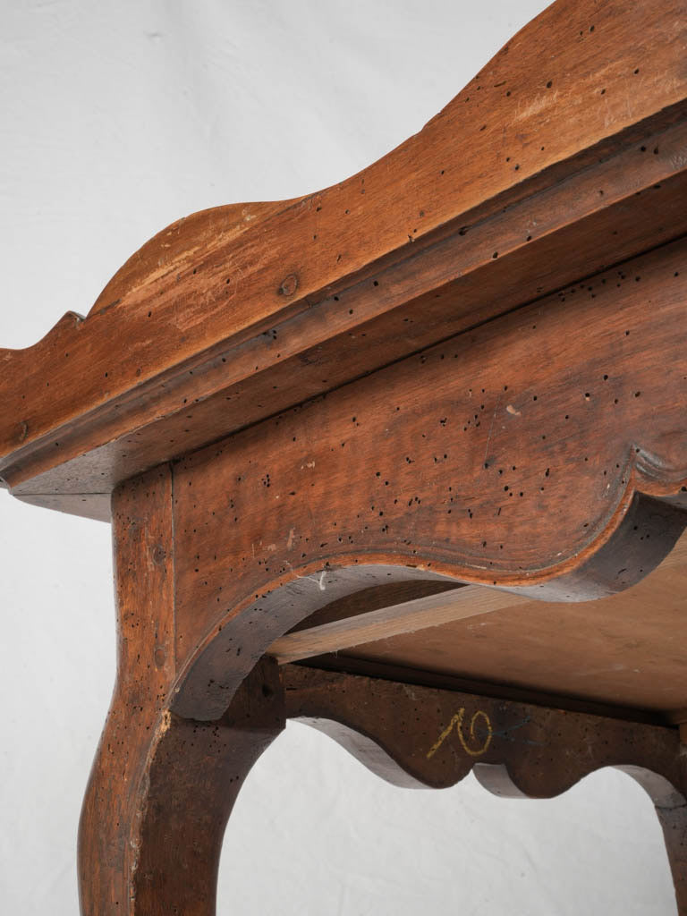 Mature-toned walnut writing surface
