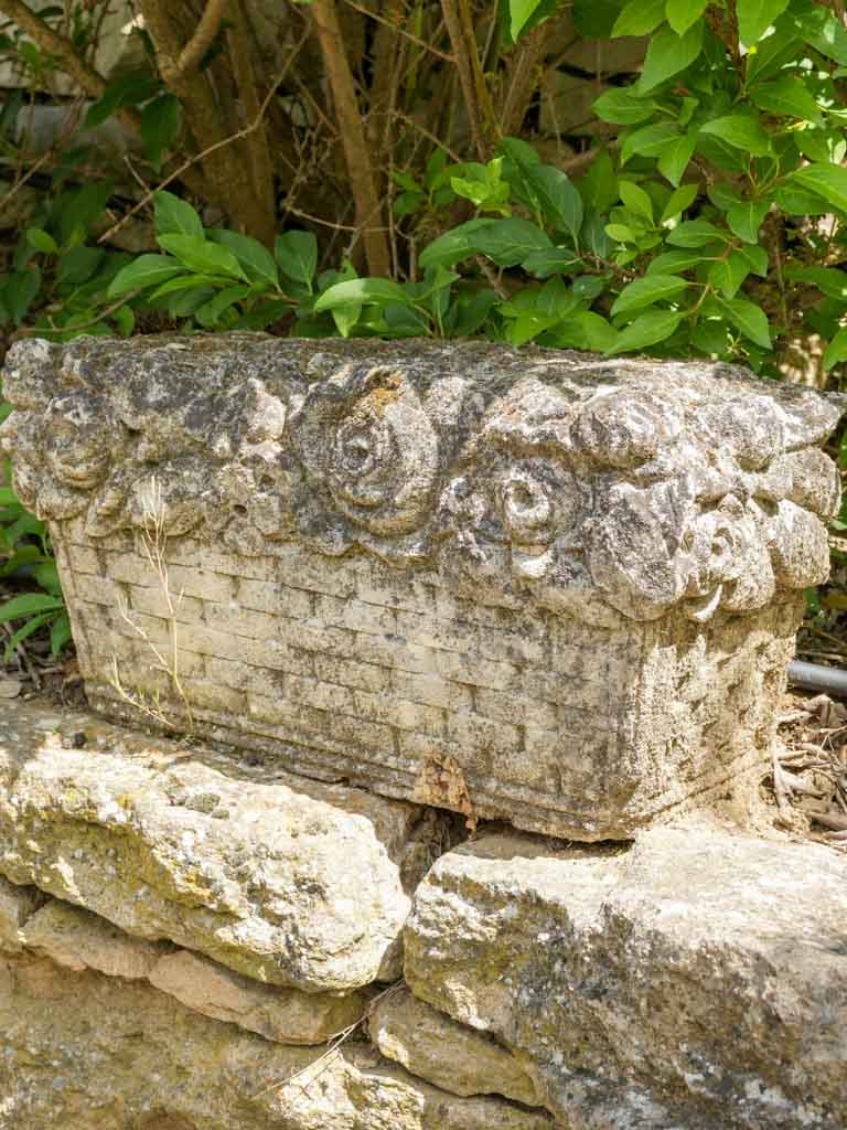 Rustic, weathered rectangular garden ornament