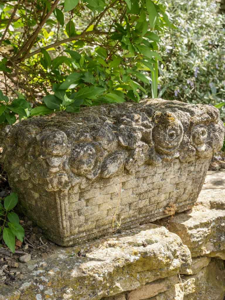 Antique, reconstituted stone fruit and flower sculpture