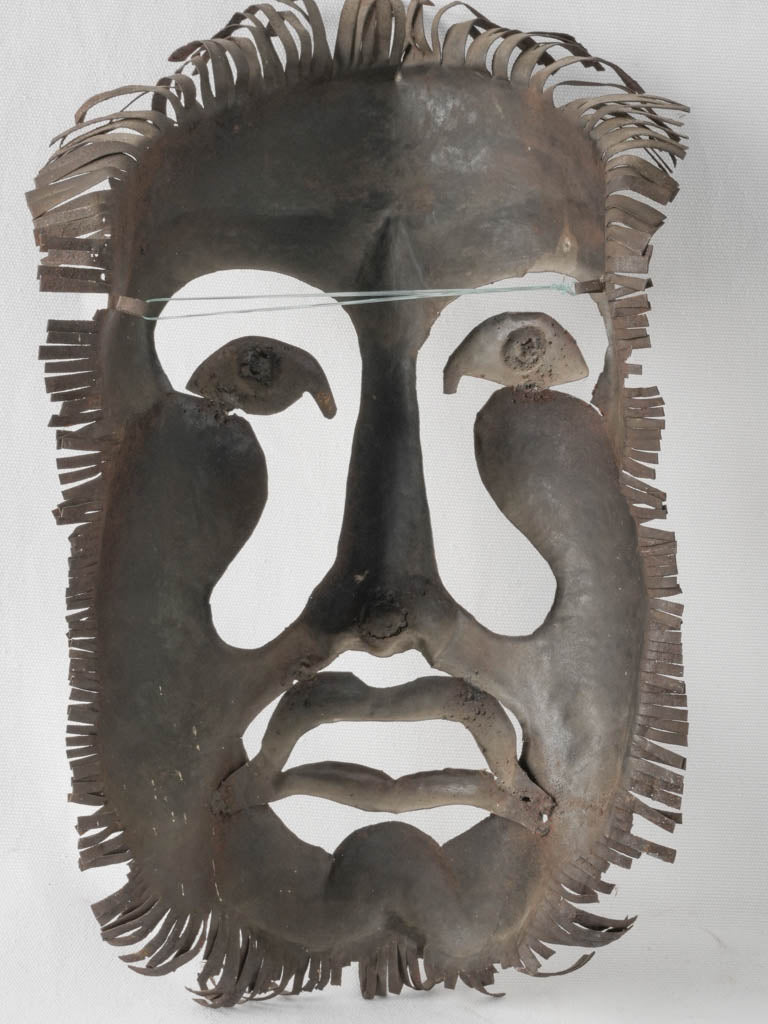 Haunting Surrealist Metal Mask Sculpture