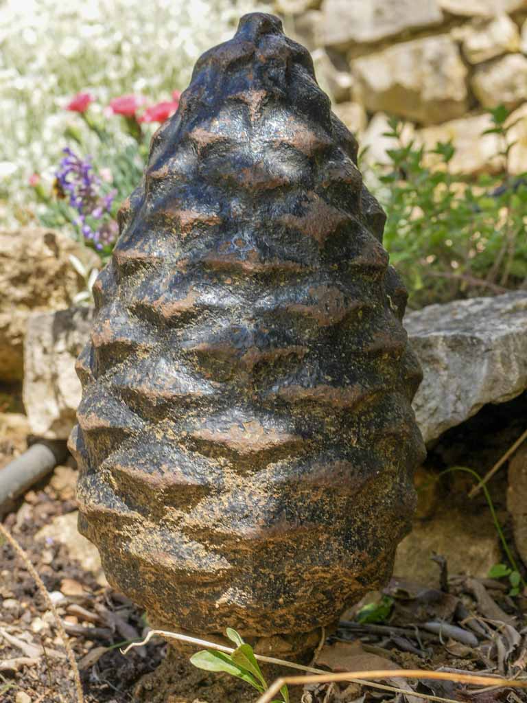 Aged iron pinecone yard ornament
