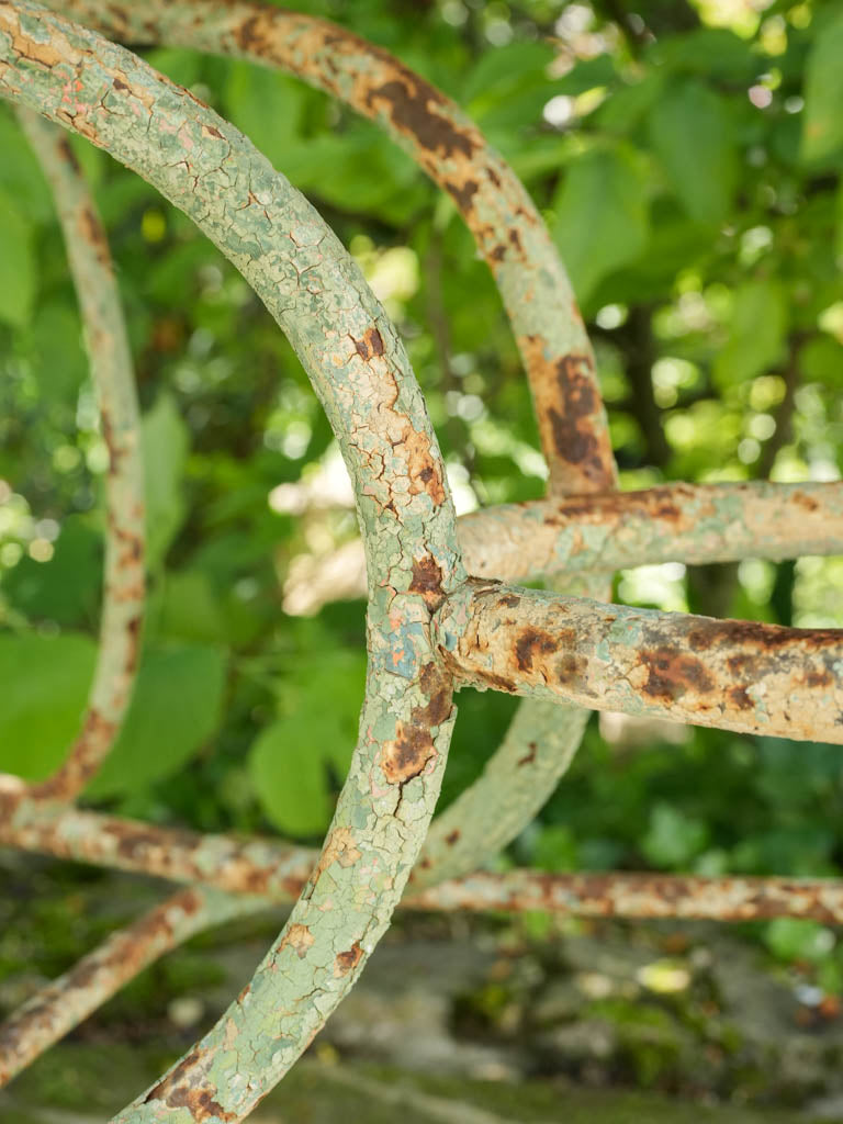 Antique, aged wrought iron table