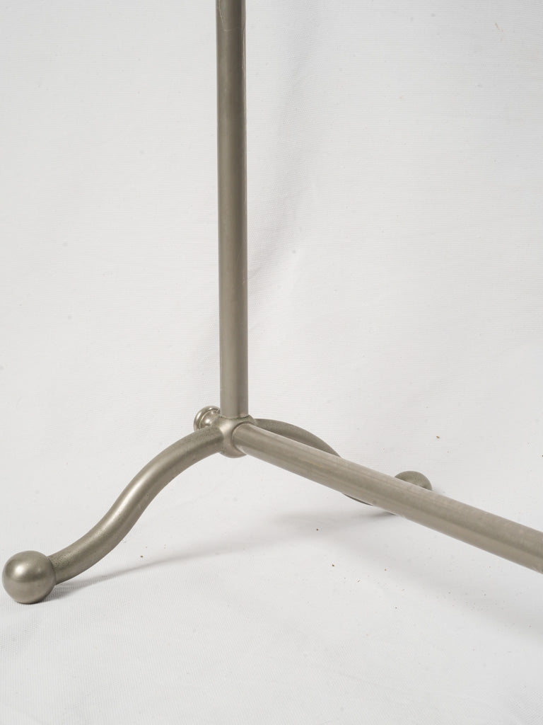 Gleaming nickel-plated brass stand