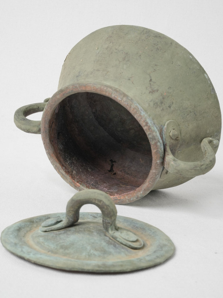 Ornate 19th-century cooking vessel