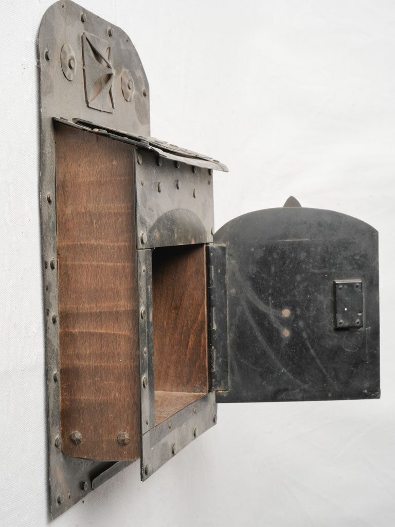 Evocative aged pierced decoration postbox