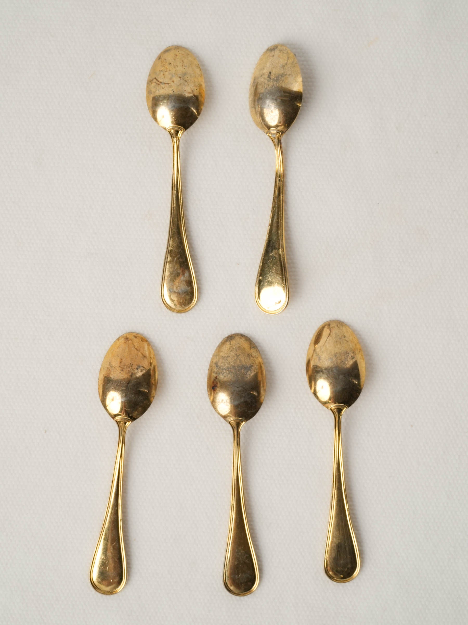 Set of five caviar spoons with gold patina
