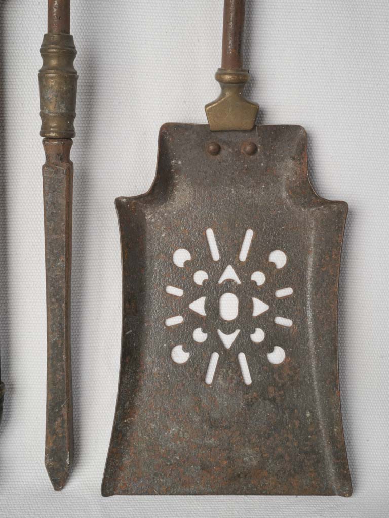 Warm brass fireplace utensils