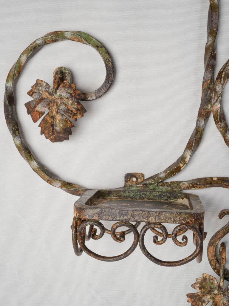 Weathered painted iron wall rack