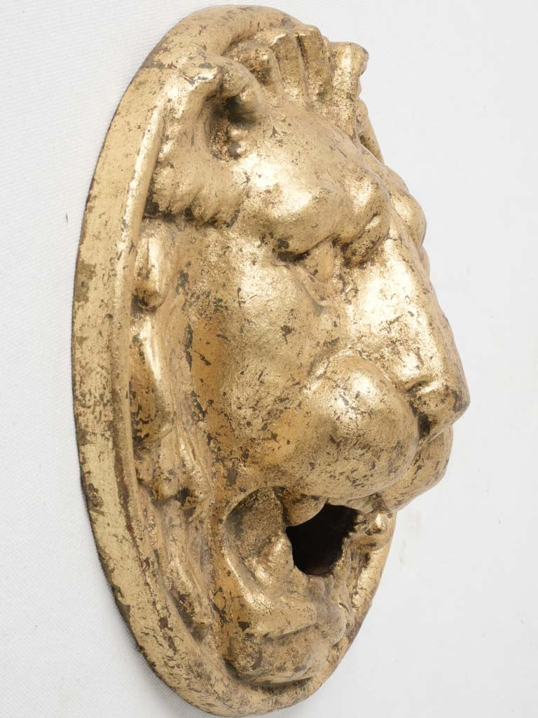 Quintessentially French gold lion fountain head