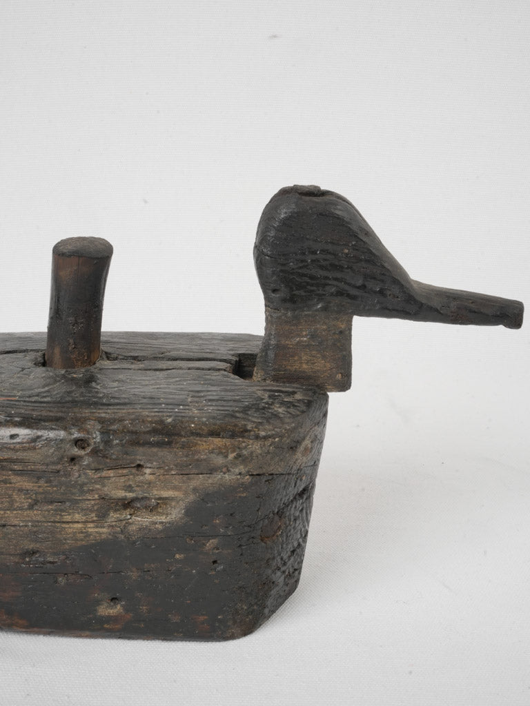 Patina-finished folk art duck decoy
