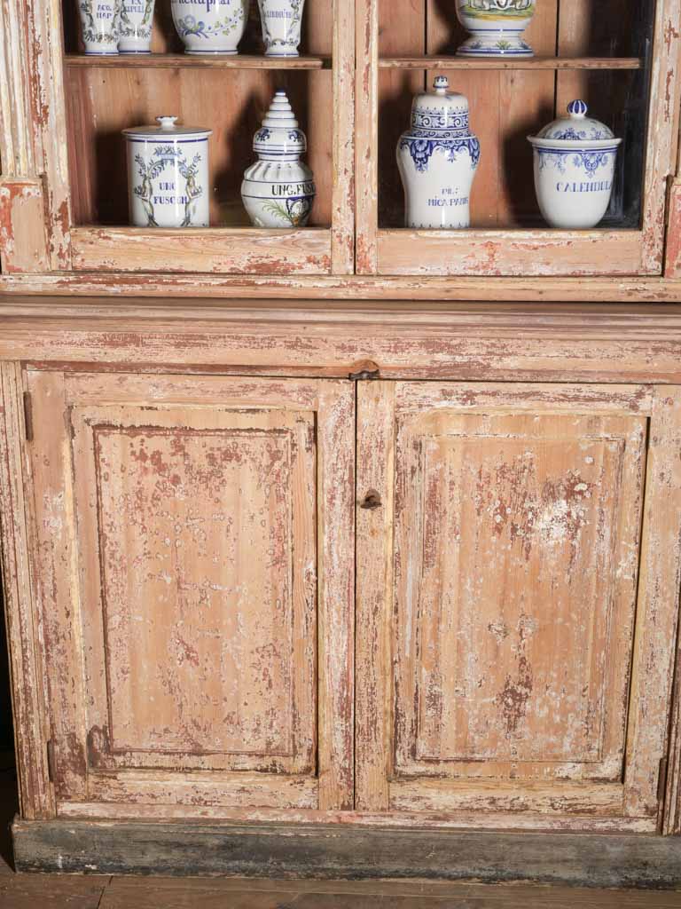 Modestly detailed antiqued French vitrine