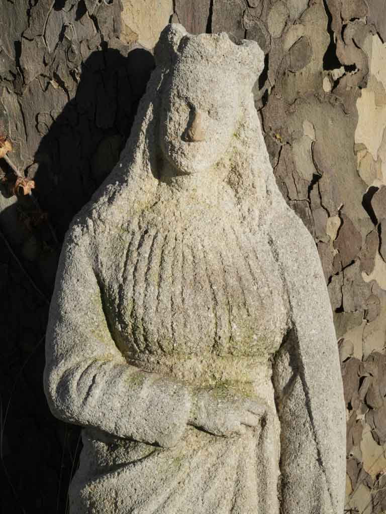 Weathered crowned lady garden sculpture