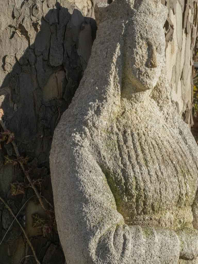 Timeless weathered garden maiden statue