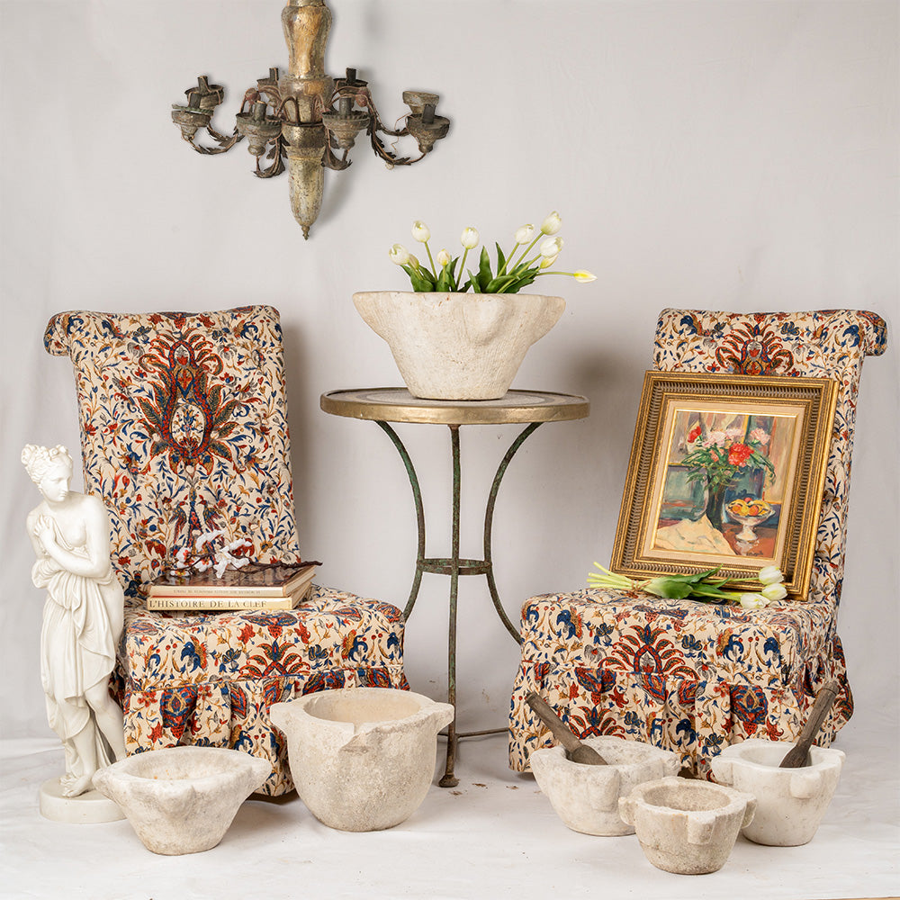 French button-detailed upholstered chairs