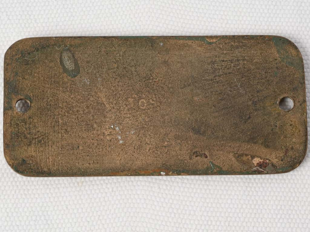 Aged decorative French travel plaque