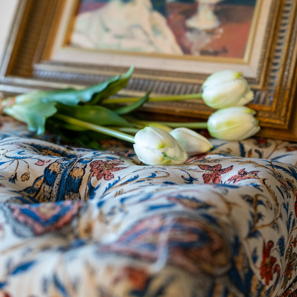 Pair of upholstered chairs w/ ruffle skirts & front wheels