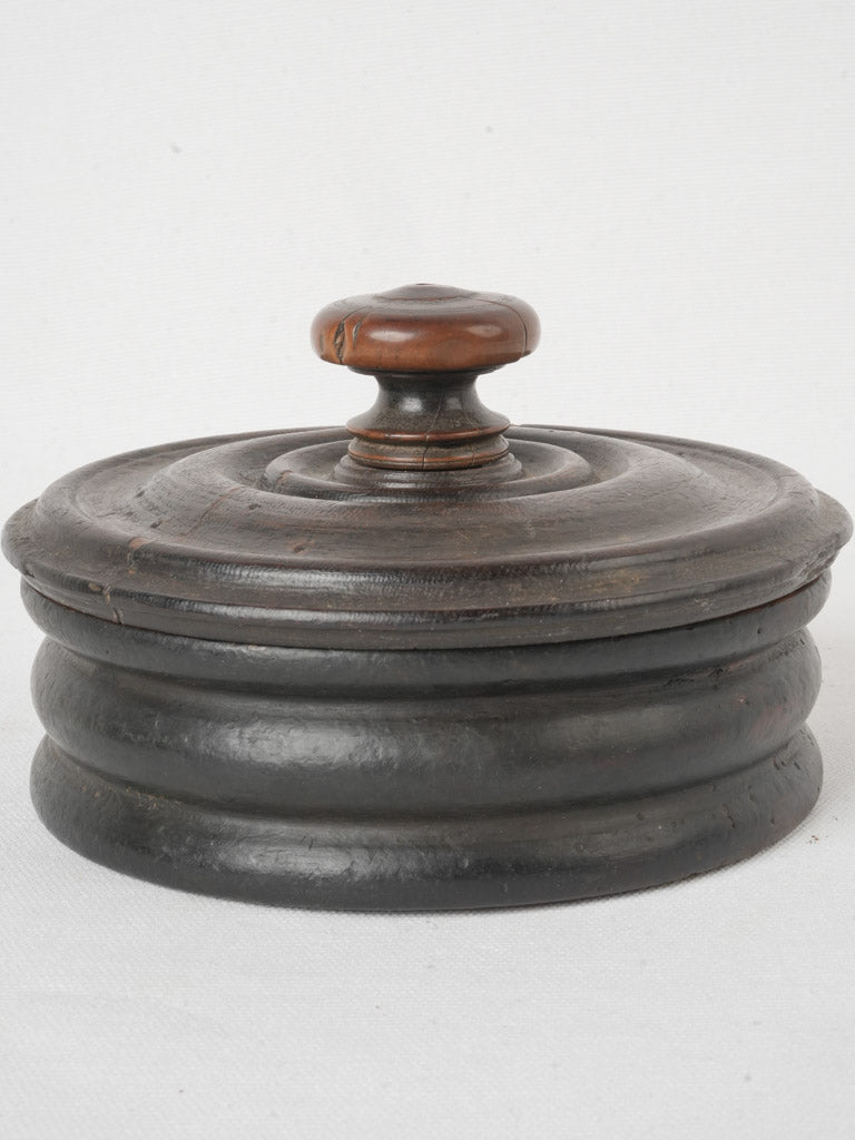 Historical round wooden spice vessel