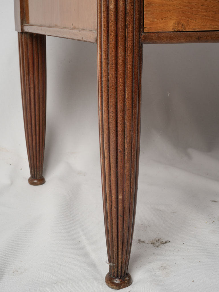 Sculpted legged storage piece