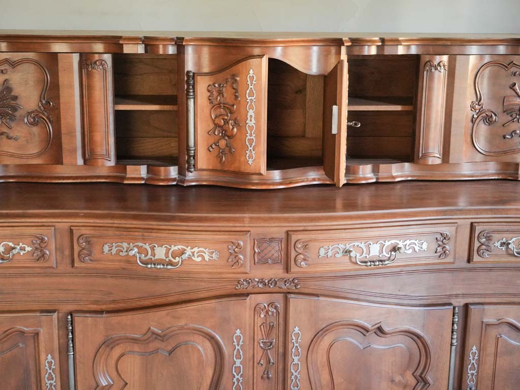 Finely sculpted walnut cabinet