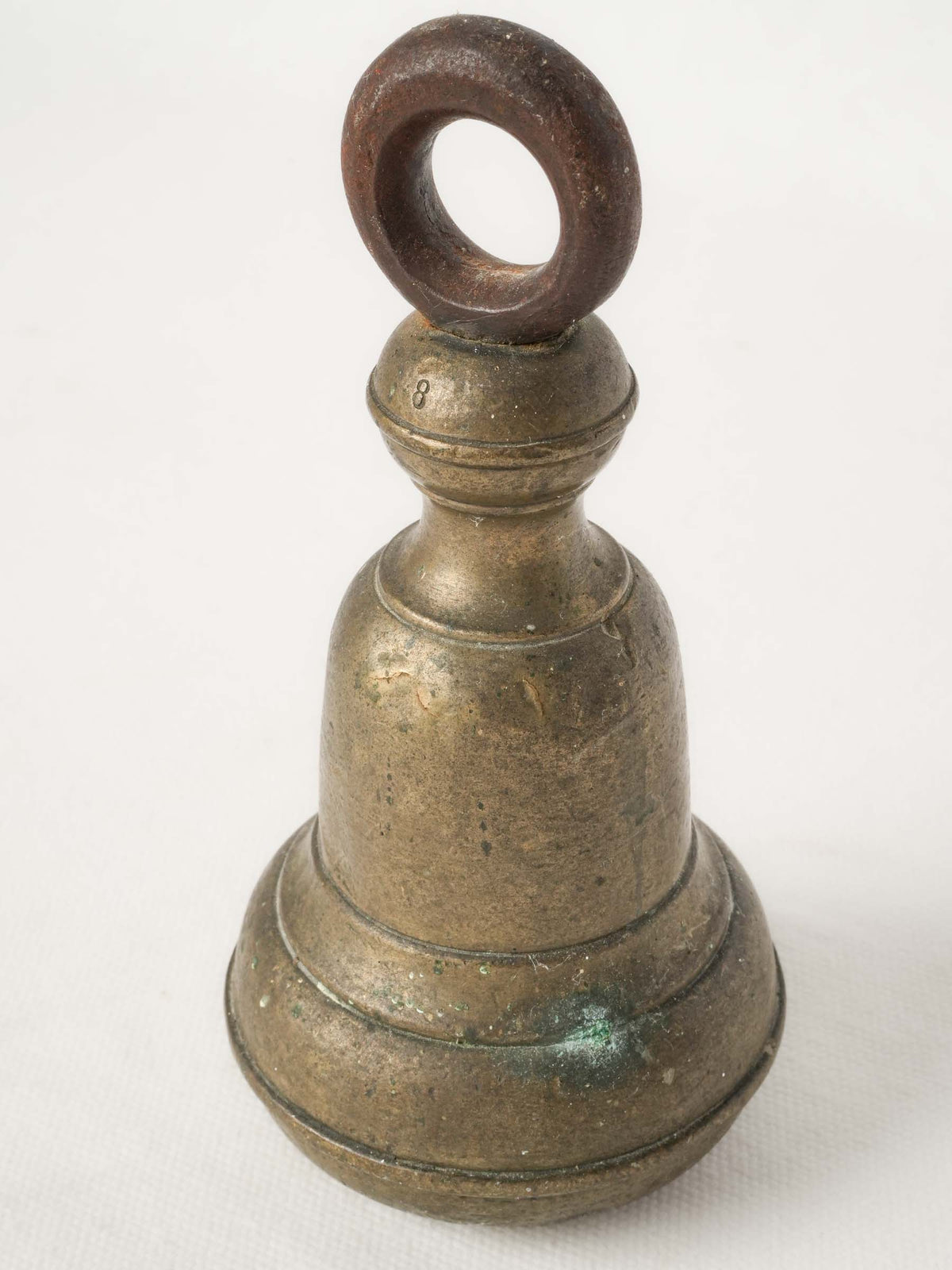 Patina-finished iron suspension weight