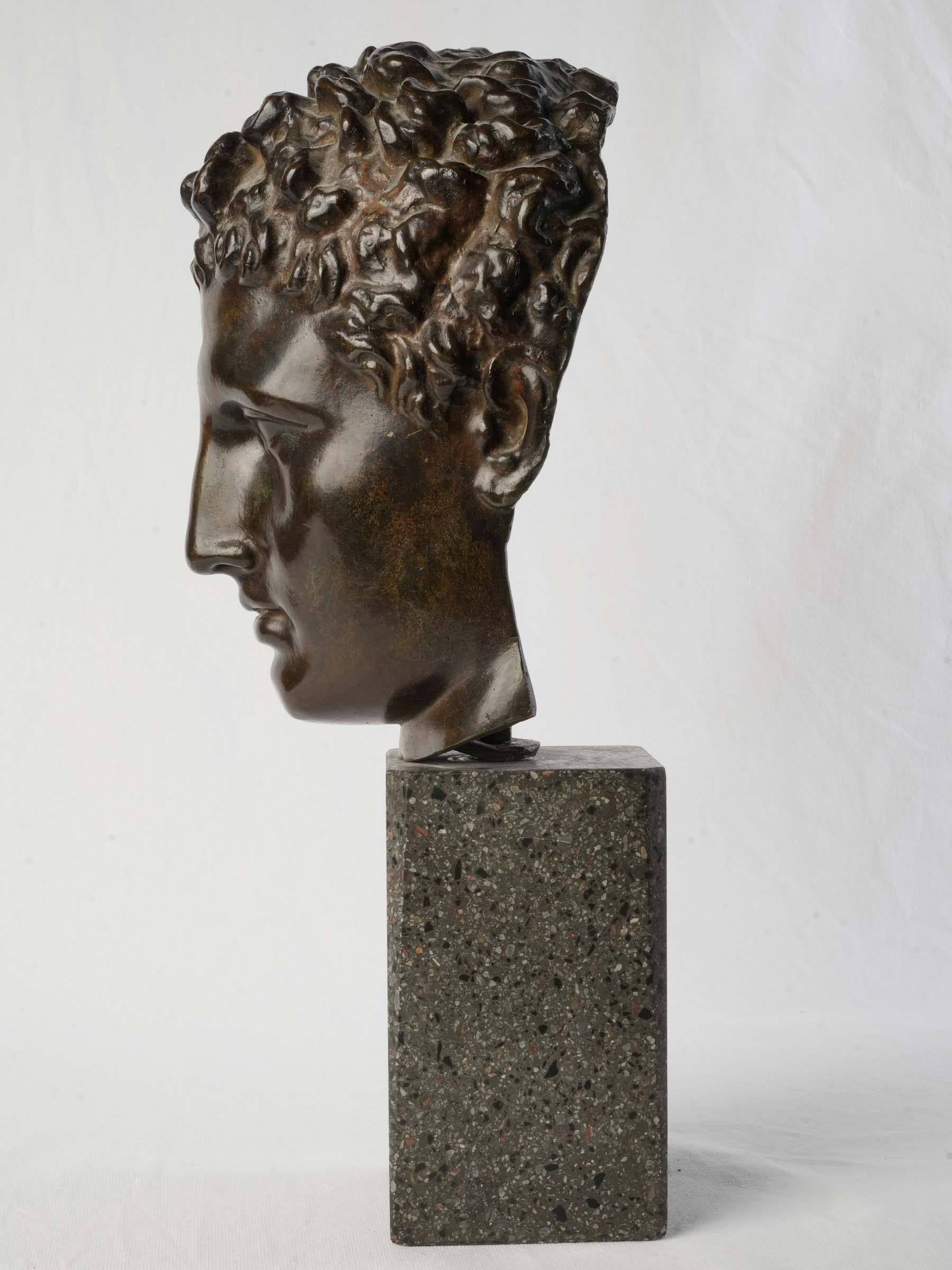 Tightly curled hair bronze figure