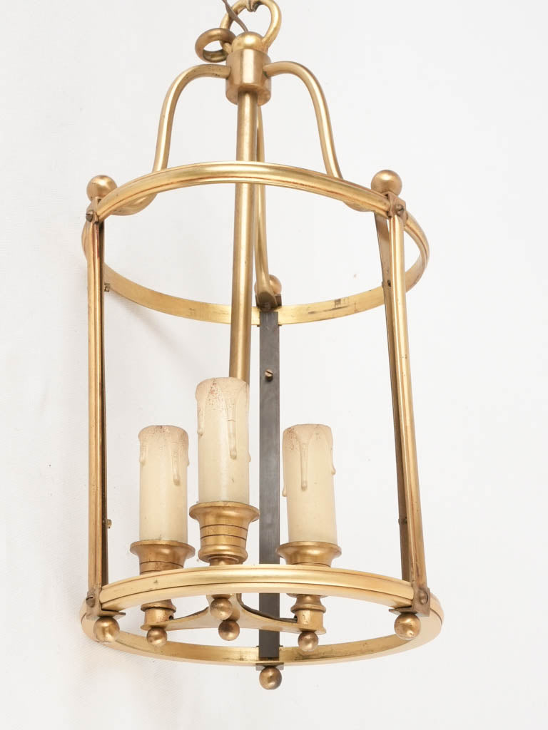 Timeless brass three-globe chandelier