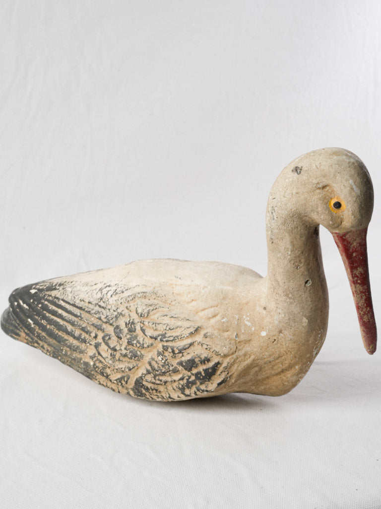 Authentic timeworn cement stork sculpture