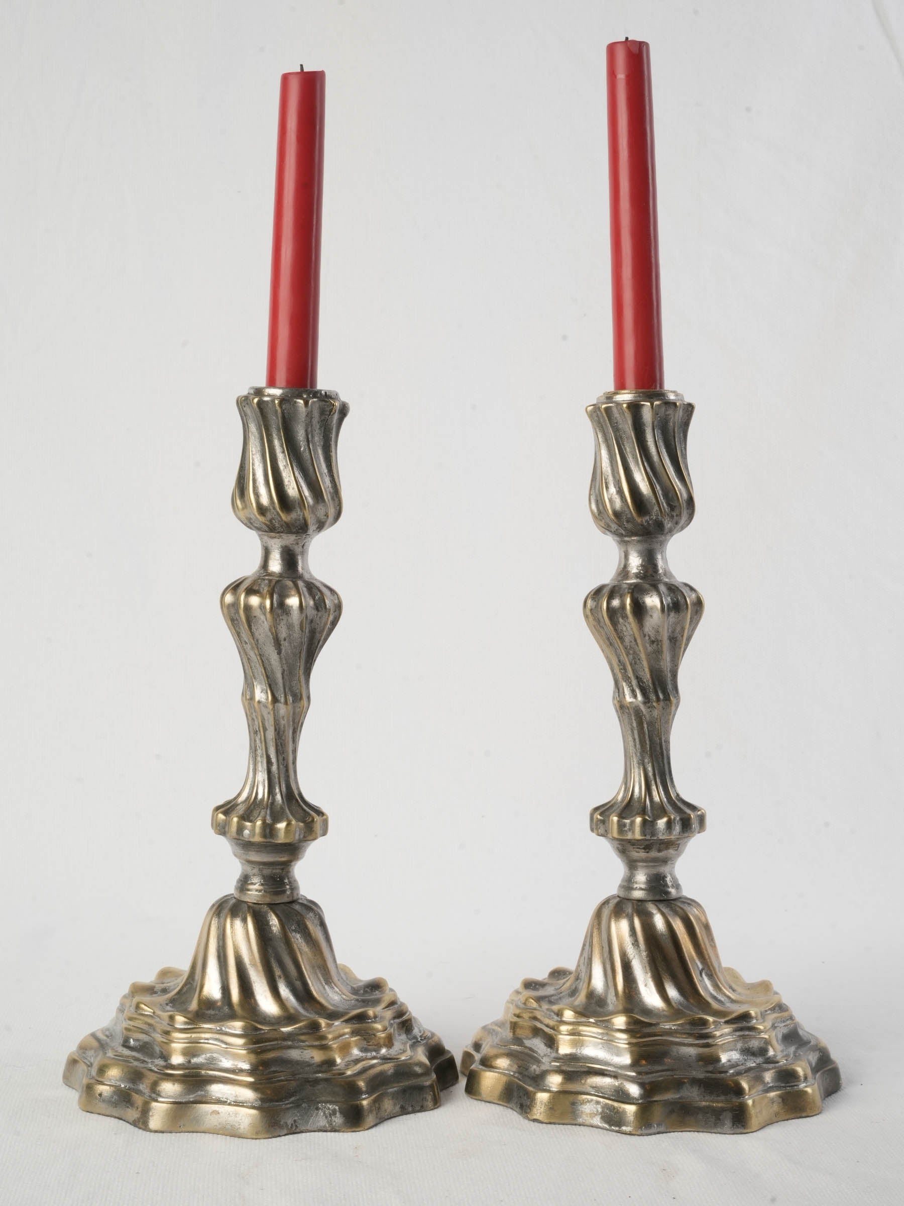 Patinated brass Rococo candlesticks