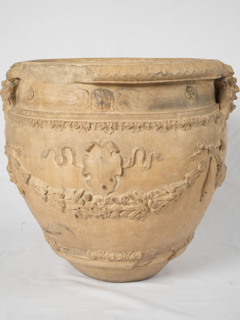 Vintage angel-detailed garden terracotta urn