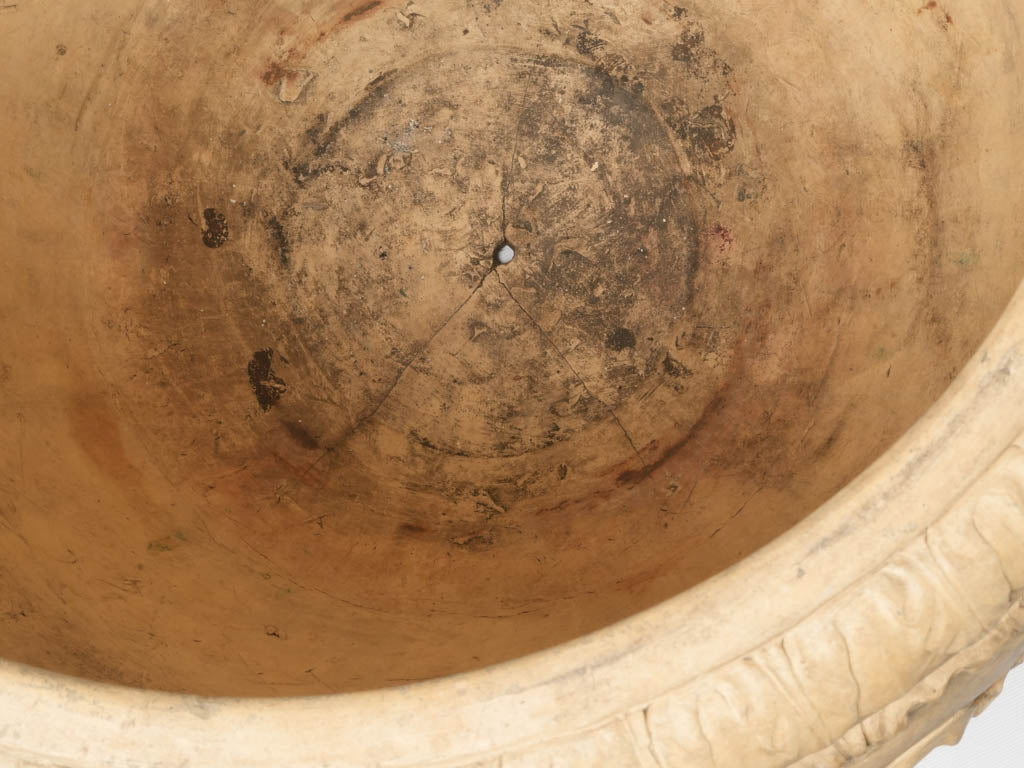 Aged terracotta urn with makers' stamp