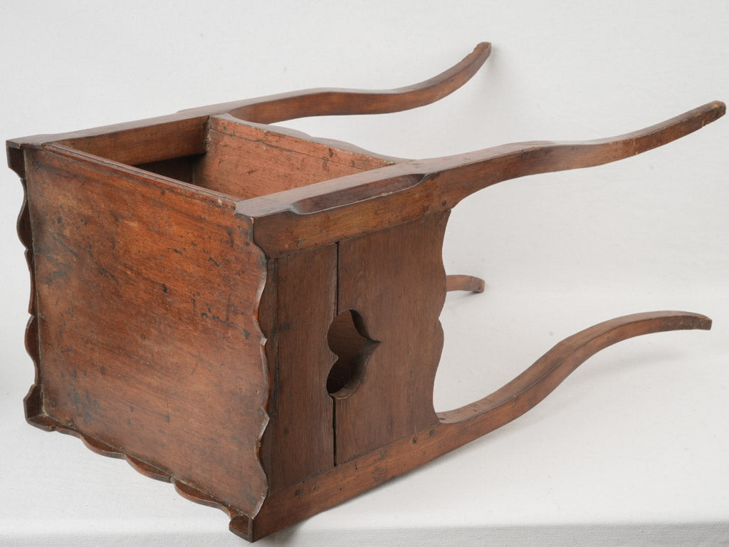 Sculptural antique bedside table