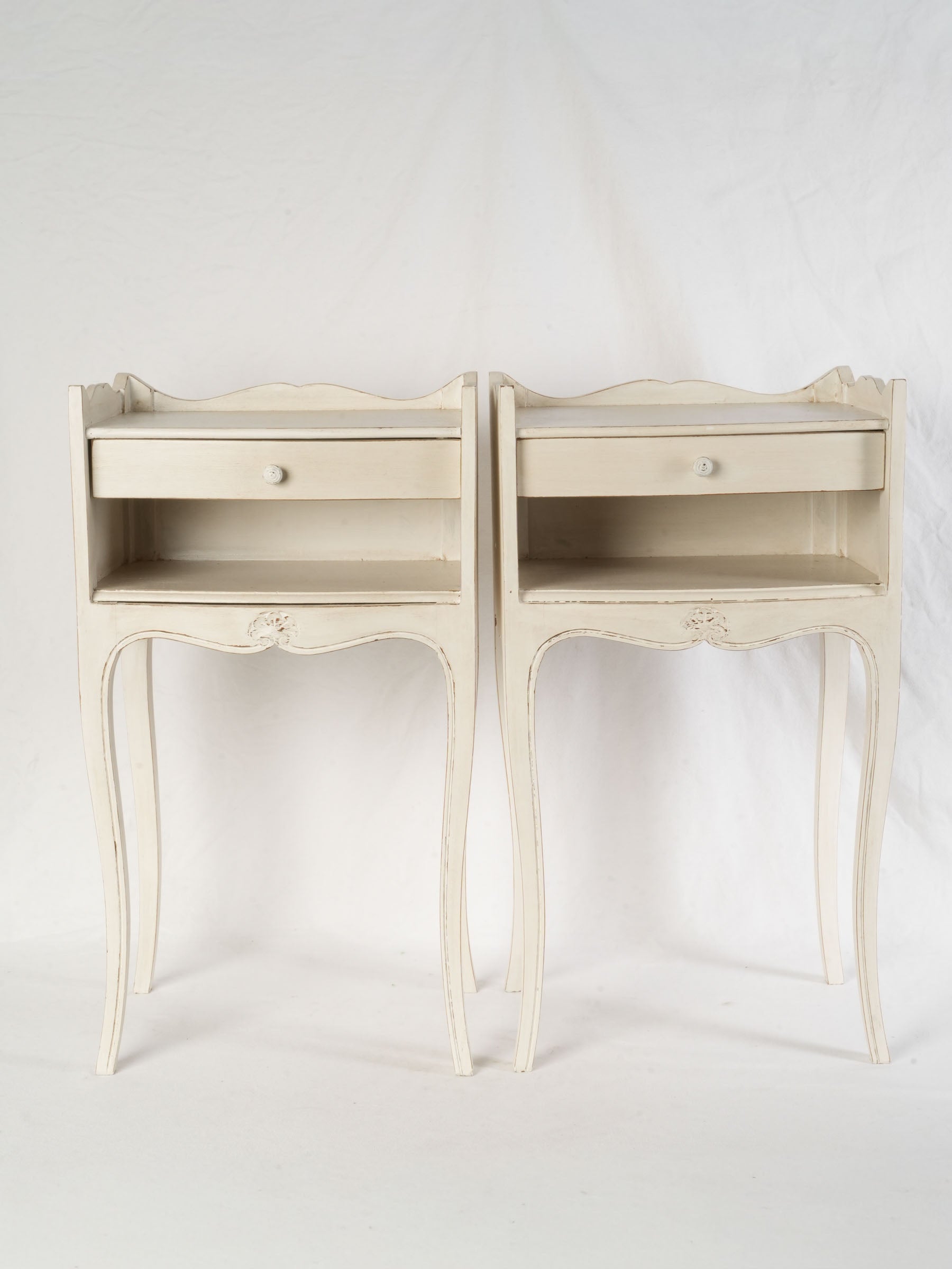 Antique ivory-painted nightstands