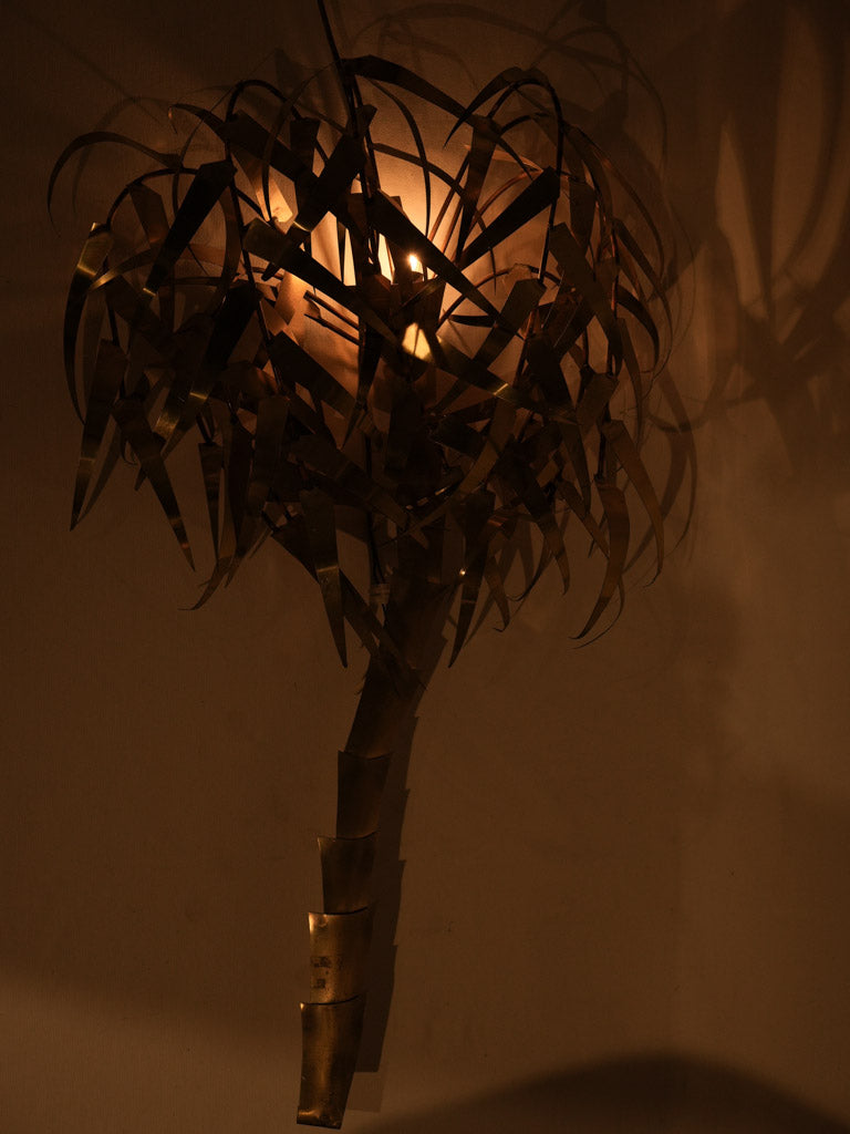 Striking brass wall sconce