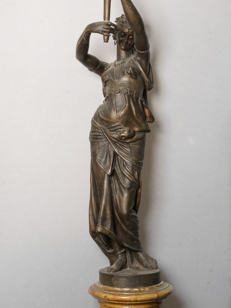 Dark-patinated female figure sculpture