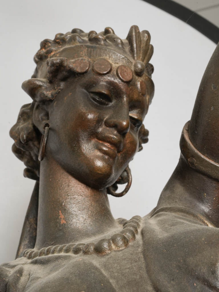 Finely modeled garments cast-iron torchère