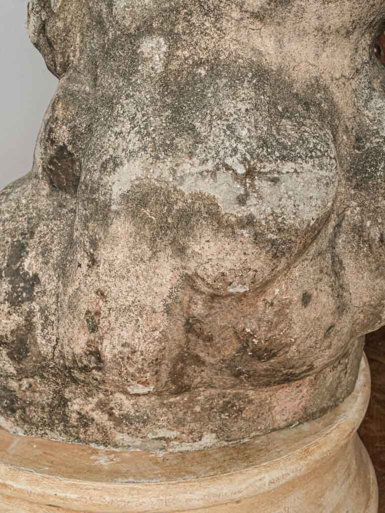 Patina-rich aged French stone Cupid