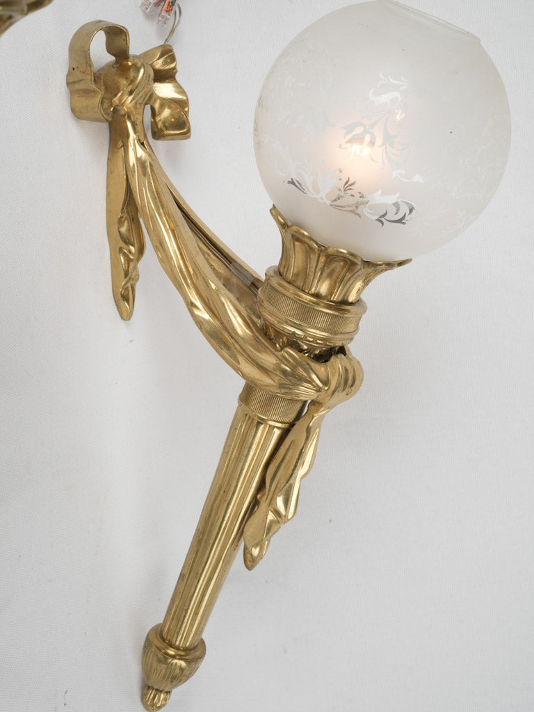 Refined Louis XVI-style gilt wall lights
