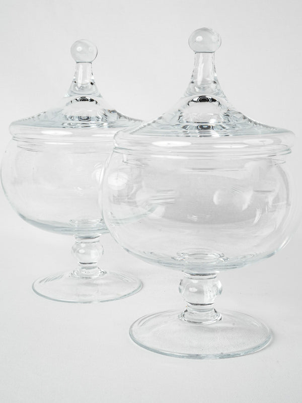 Pair of round lidded glass candy jars 11¾"