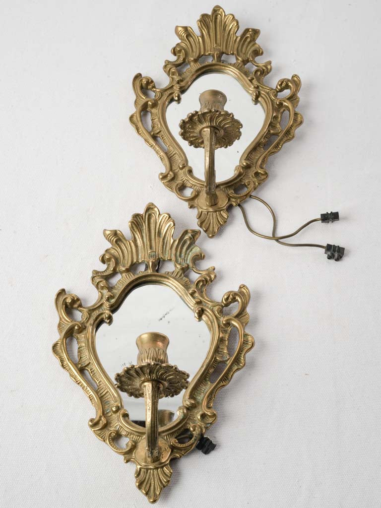 Rococo-inspired brass reflectors antique