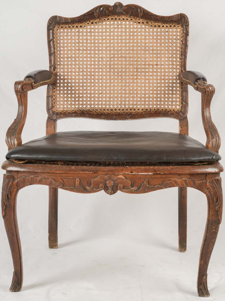 Graceful curves cane-back armchair