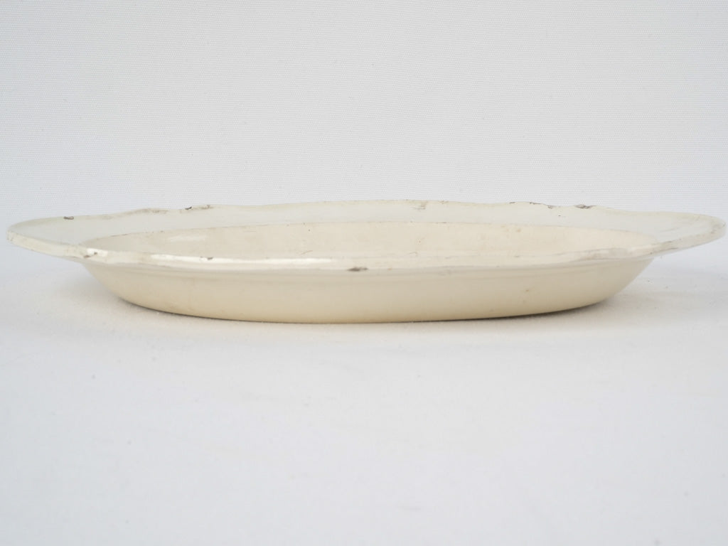 Vintage, well-loved, oval, white, earthenware platter