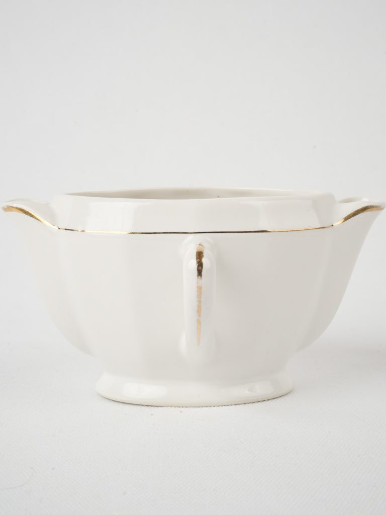 Exquisite gold-rimmed 'maigre gras' sauceboat