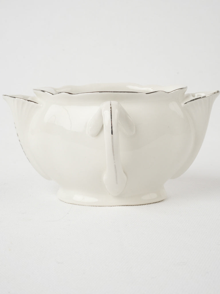 Elegant silver-trimmed sauce boat from France