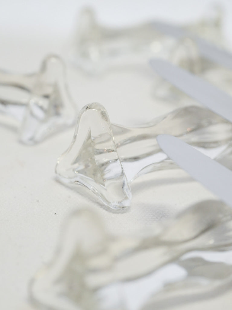 Clear light-refracting table accessories