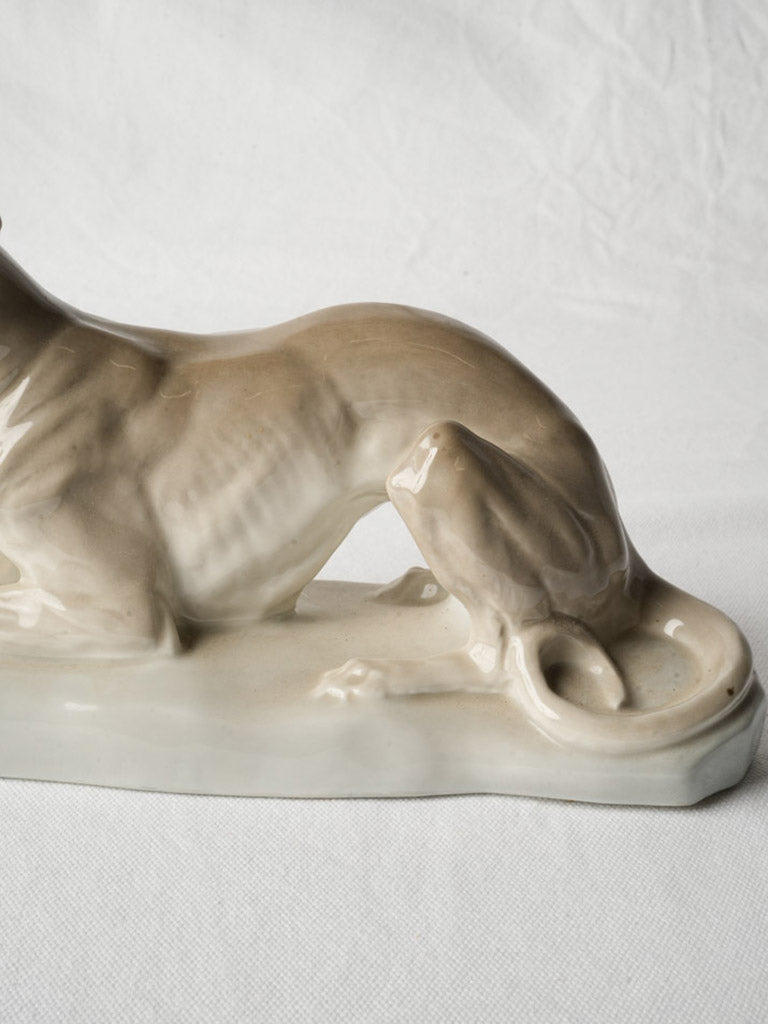Sleek antique animal sculpture