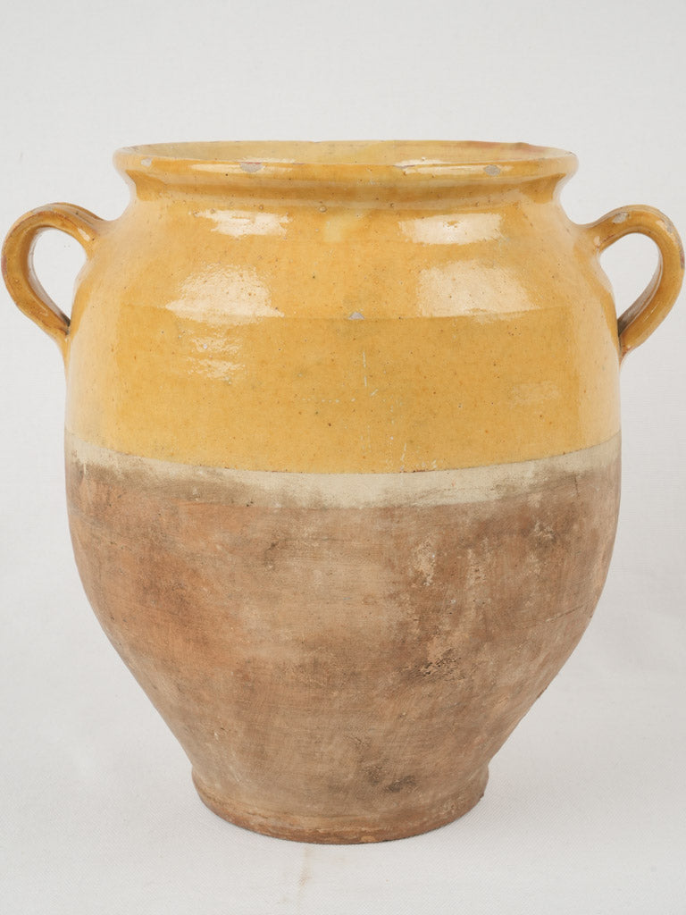 Elegant, antique, yellow-footed confit pot