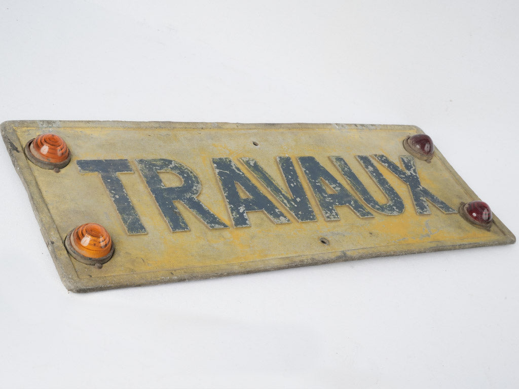 Patina-covered "Travaux" road sign